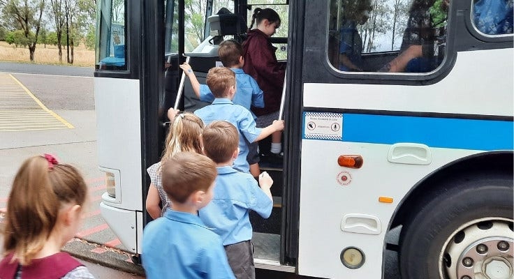 Students getting on to a bus